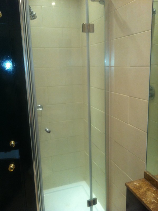 Frameless glass shower enclosure with chrome fittings in Clapham Junction