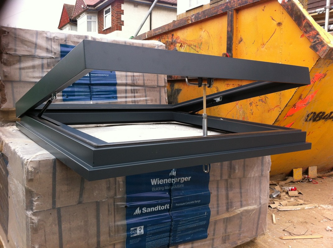 Opening flat roof skylight in anthracite grey installed in Clapham Junction